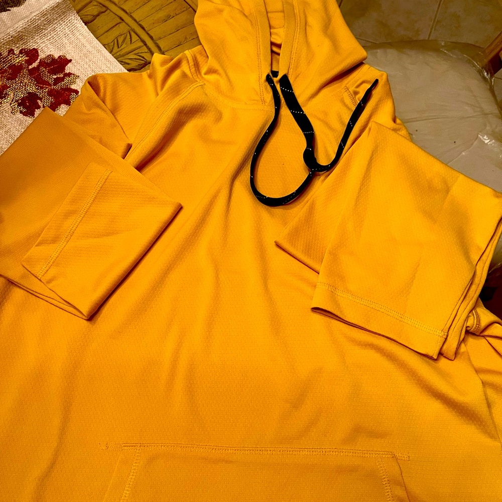 Men’s/boys hooded top with pockets. Gold in color.